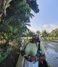 female counseling student looking up at a tree