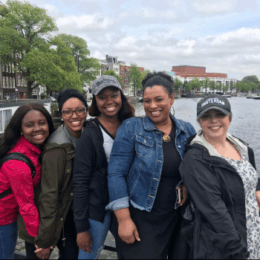 group of female counseling students standing and smiling outdoors