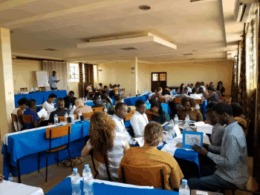 large group of people sitting indoors