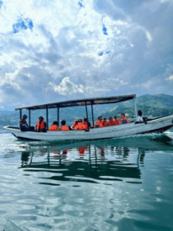 counseling students on a boat on a lake